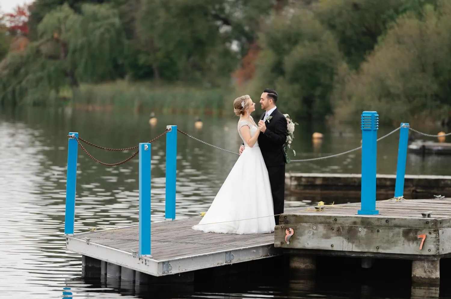 A couple smiling on the Dow's Lake docks