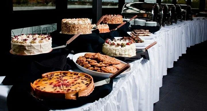A dessert table at a Lago reception, with cakes, cheesecake and pastries