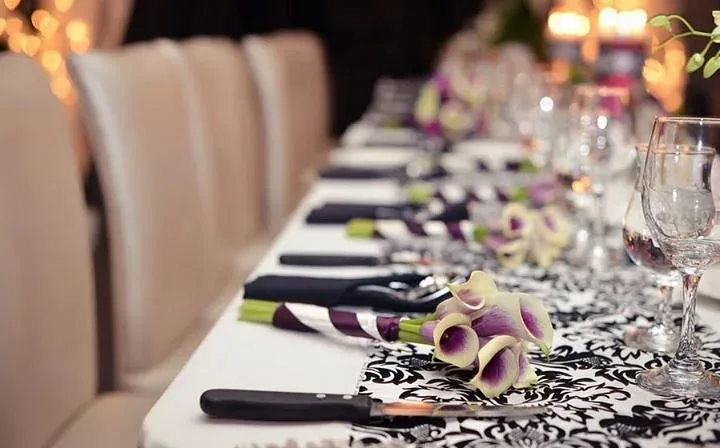 A table set for a celebration at Lago, with calla lilies and candlelight