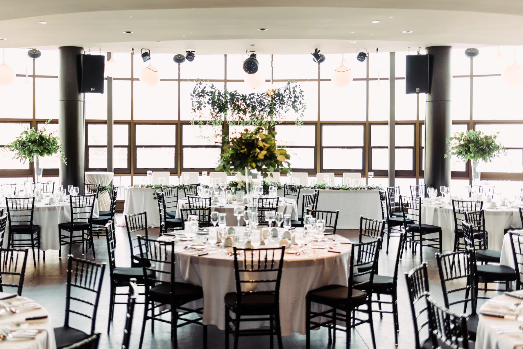 A fully set wedding reception in Lago's Vista Room overlooking Dow's Lake
