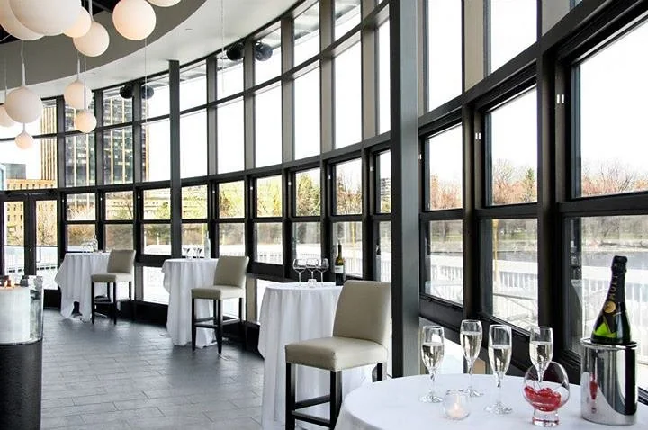 Lago's Vista Room, a curved wall of floor-to-ceiling windows over Dow's Lake